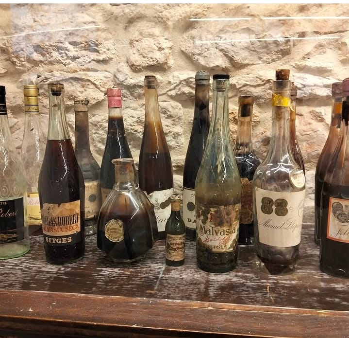 Historic Malvasia bottles from Sitges at a private wine tasting